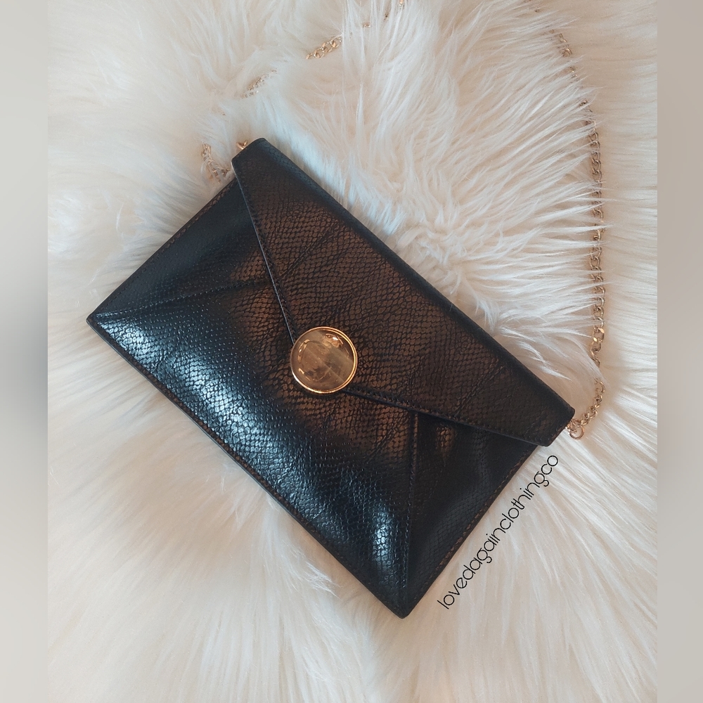 Beautiful Celine Dion leather clutch with magnet closure.